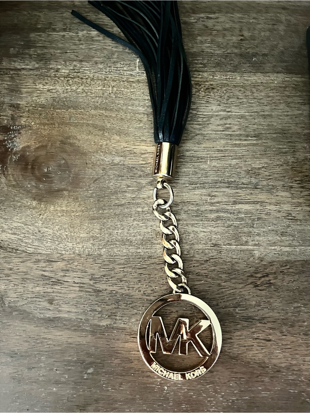 Michael Kors Black Leather Tassel with Gold MK Pendant